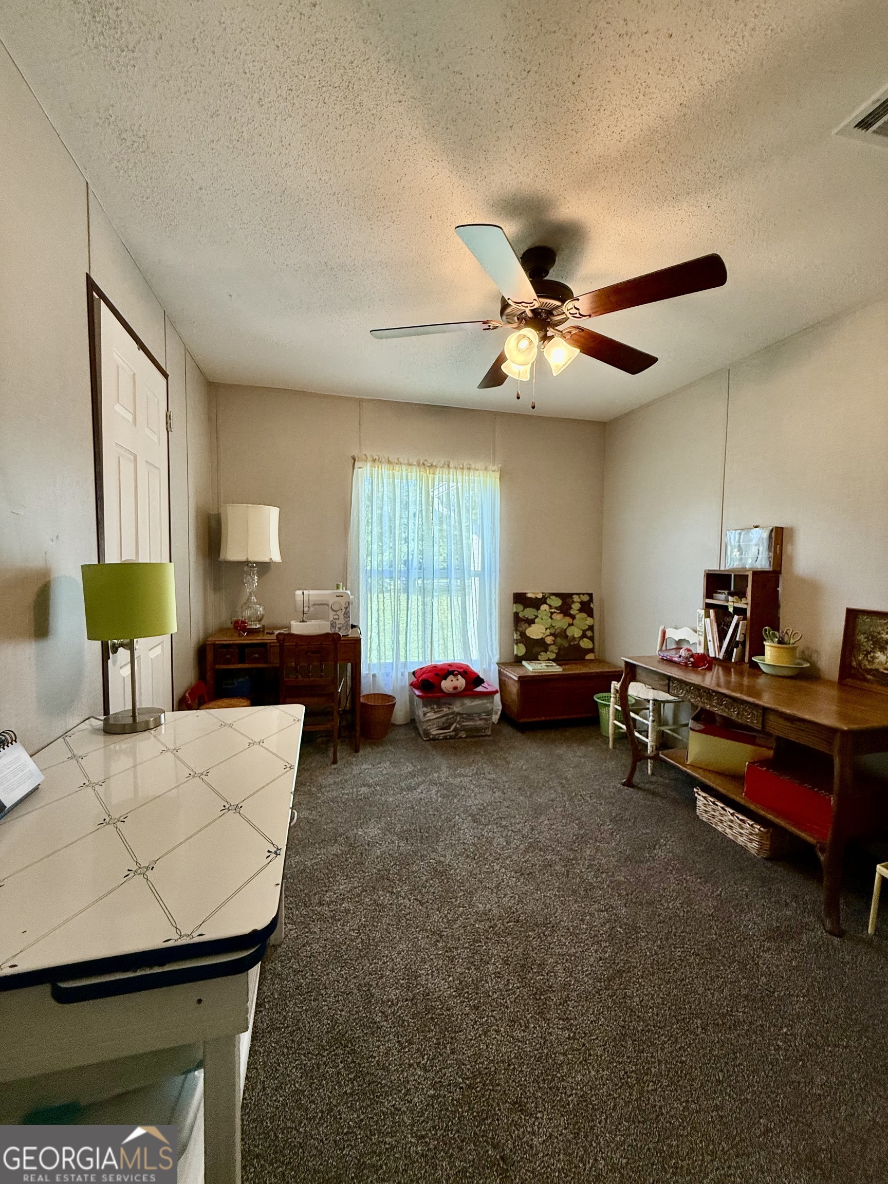 1430 Old Poor Robin Road Sylvania, GA 30467 - Photo 13 of 30 a living room with furniture and a chandelier
