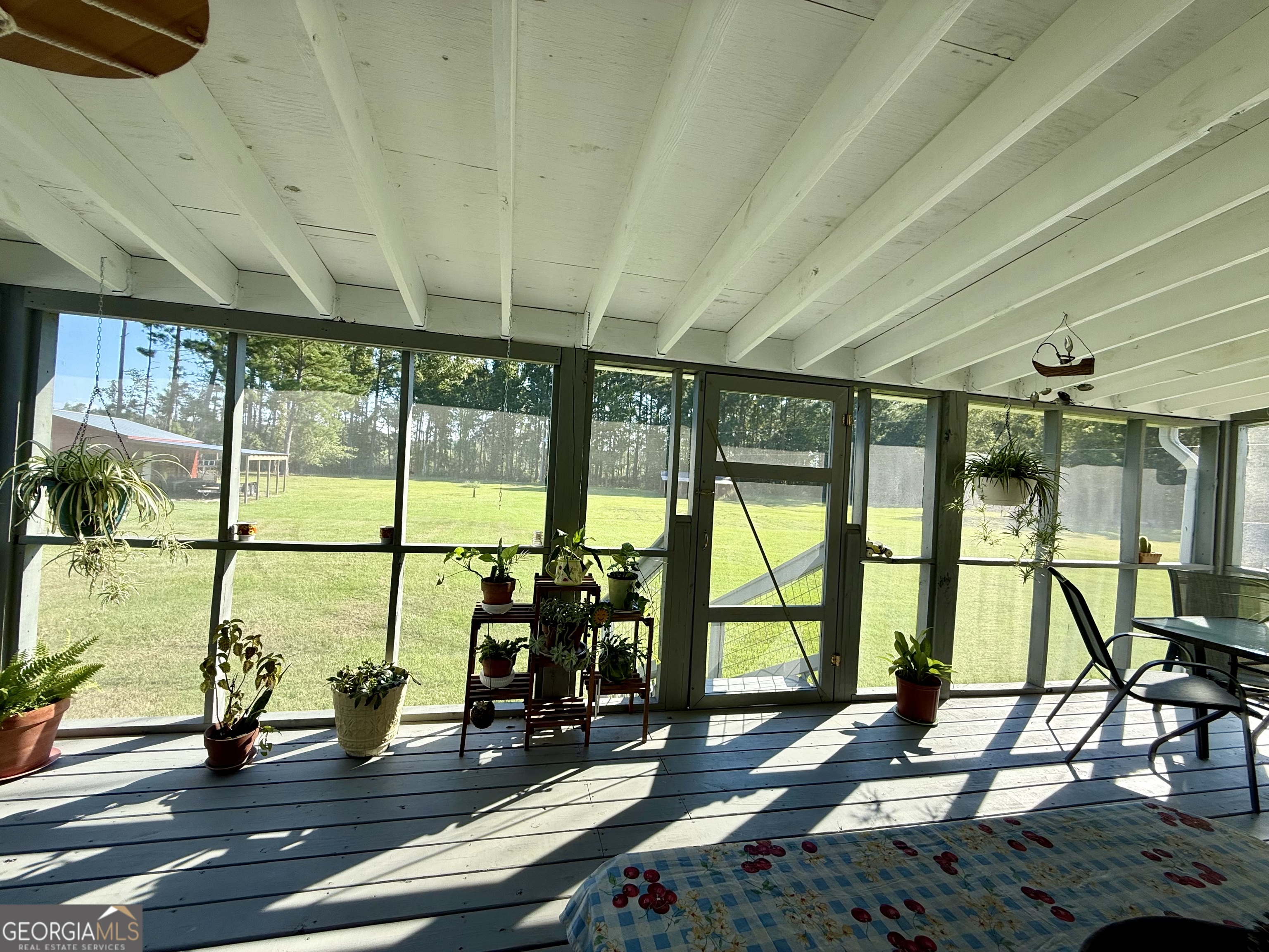 1430 Old Poor Robin Road Sylvania, GA 30467 - Photo 21 of 30 a living room with large windows