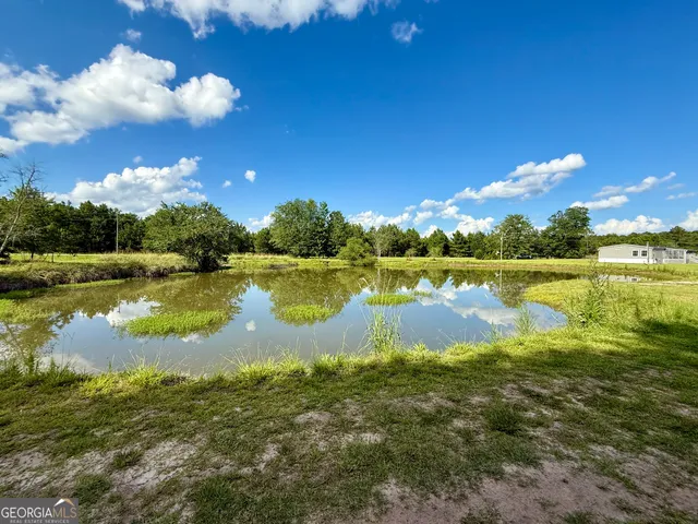 a view of a lake with a big yard