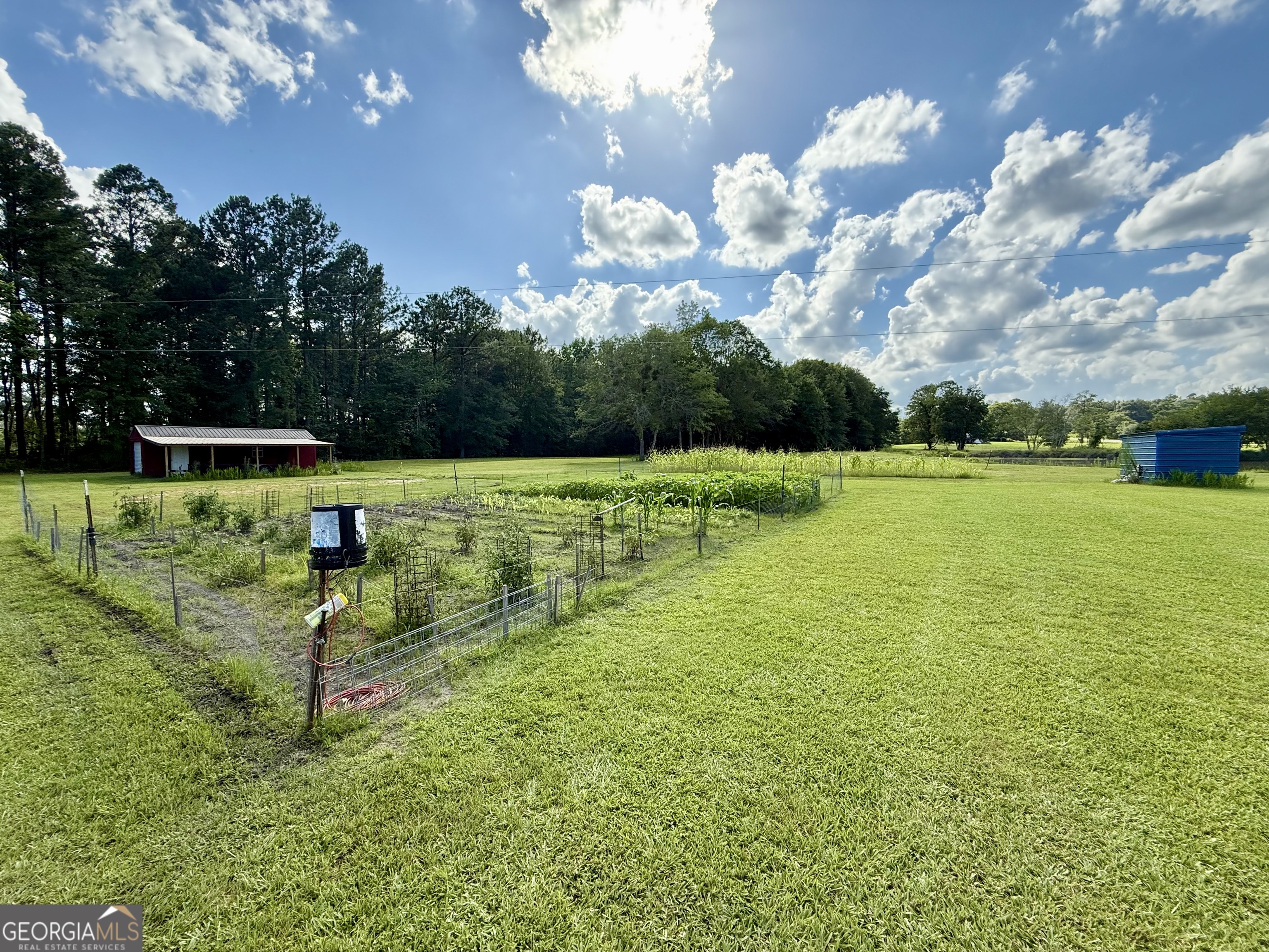 1430 Old Poor Robin Road Sylvania, GA 30467 - Photo 29 of 30 a view of a golf course with a lake