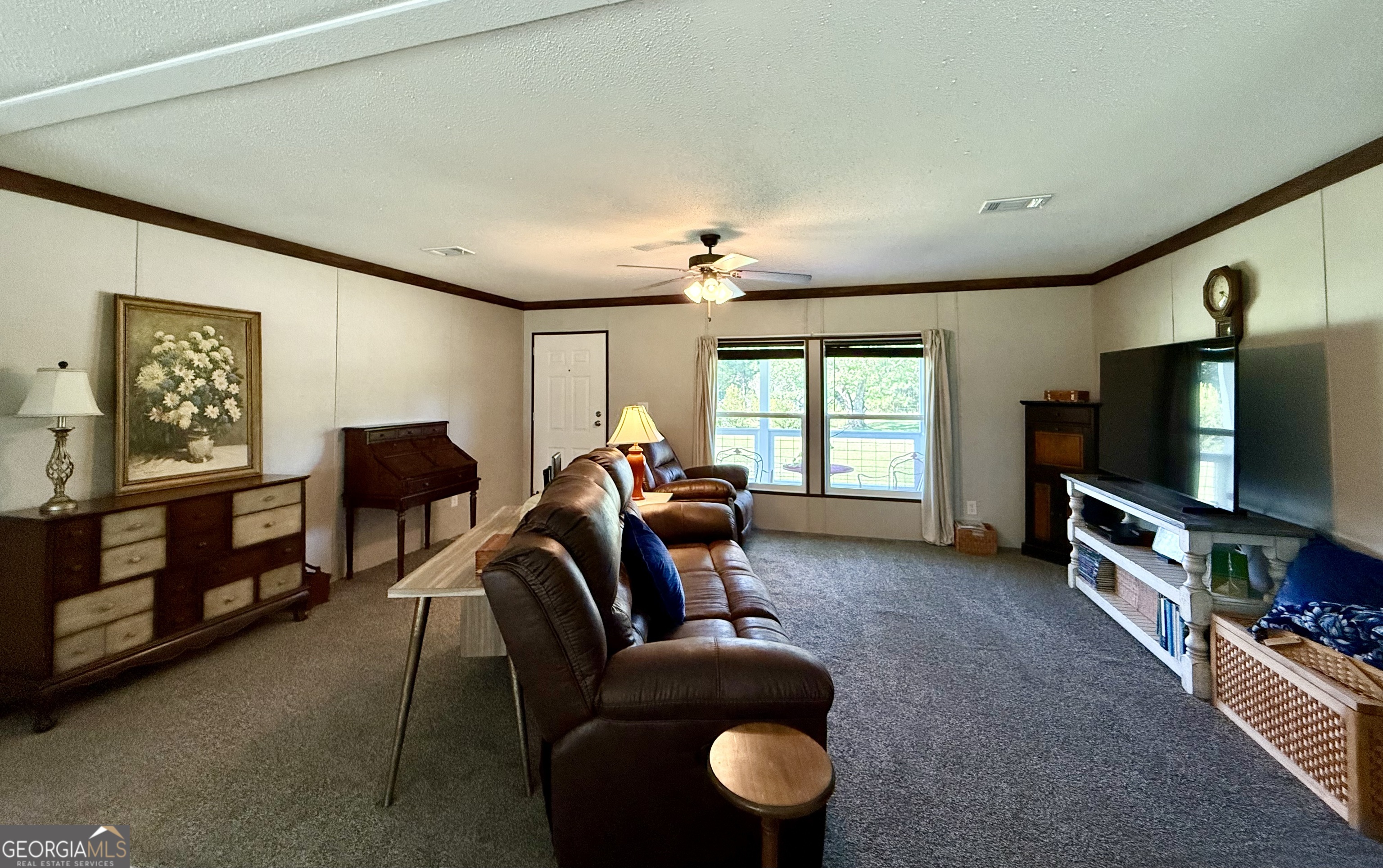 1430 Old Poor Robin Road Sylvania, GA 30467 - Photo 5 of 30 a living room with furniture and a flat screen tv