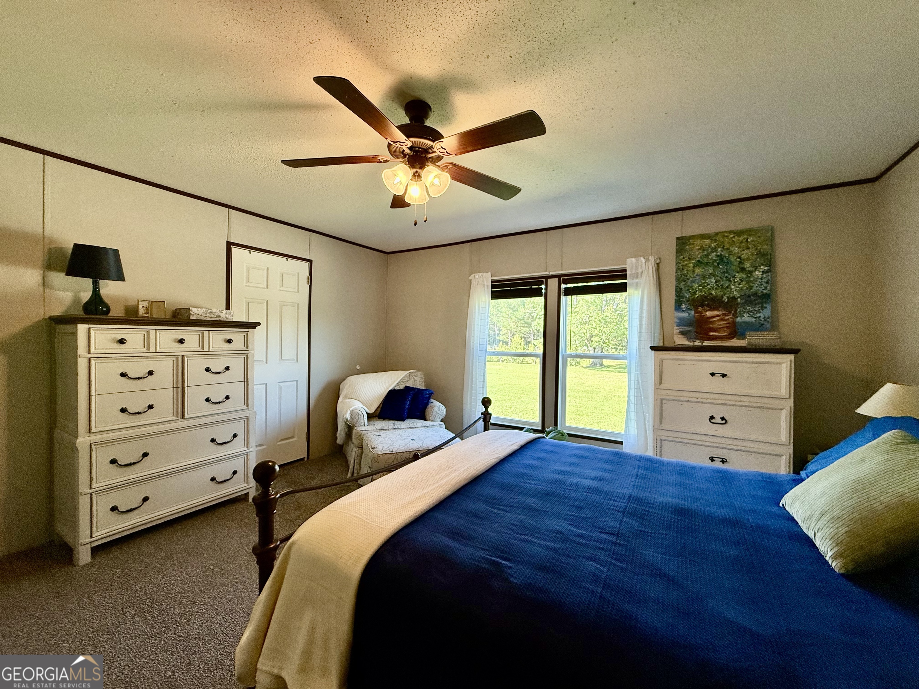 1430 Old Poor Robin Road Sylvania, GA 30467 - Photo 7 of 30 a bedroom with a bed and a dresser