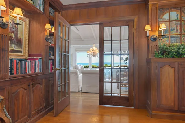 a spacious bedroom with a bed and a large window