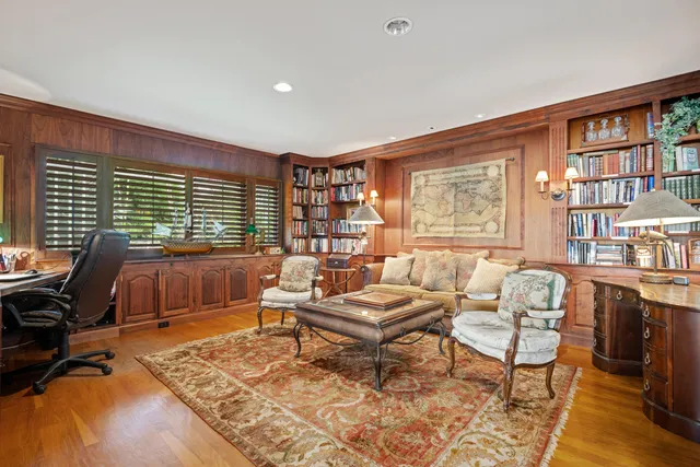 a spacious bedroom with a large bed and a dresser