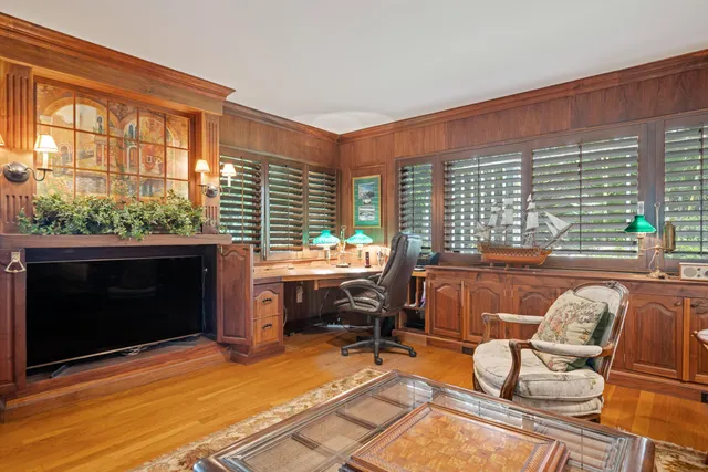 a view of a house with backyard sitting area and garden