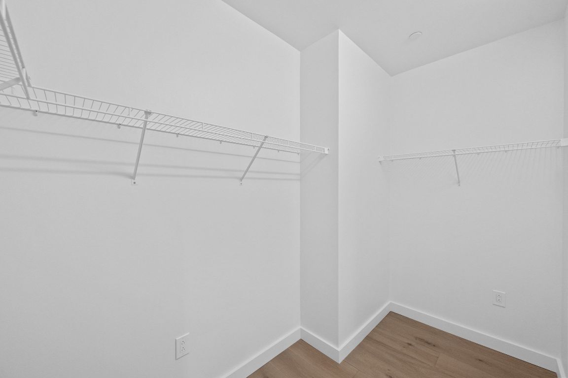 610 Davis Street, Unit 2103 Austin, TX 78701 - Photo 15 of 32 a view of a room with racks on the wall