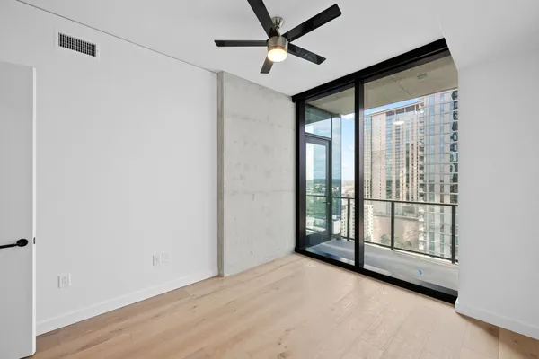 a view of an empty room with a window