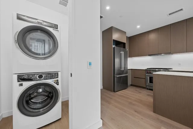 a view of a kitchen cabinets and stainless steel appliances