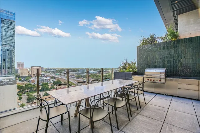 a view of a terrace with furniture and stove