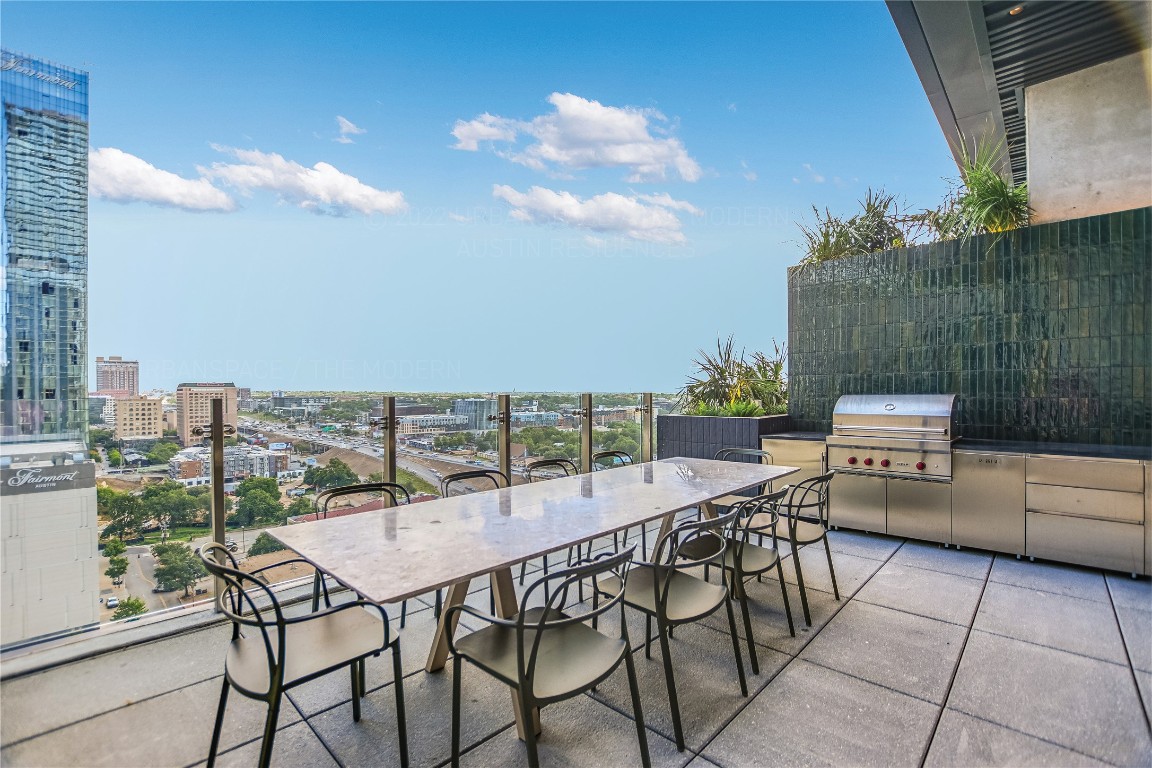 610 Davis Street, Unit 2103 Austin, TX 78701 - Photo 30 of 32 a view of a terrace with furniture and stove