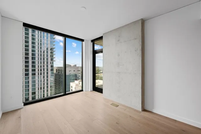 a view of a big room with windows and walls