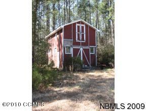 905 Fork Point Road Oriental, NC 28571 - Photo 6 of 9 Large two story storage barn has good bones and plenty of space for toys or workshop.
