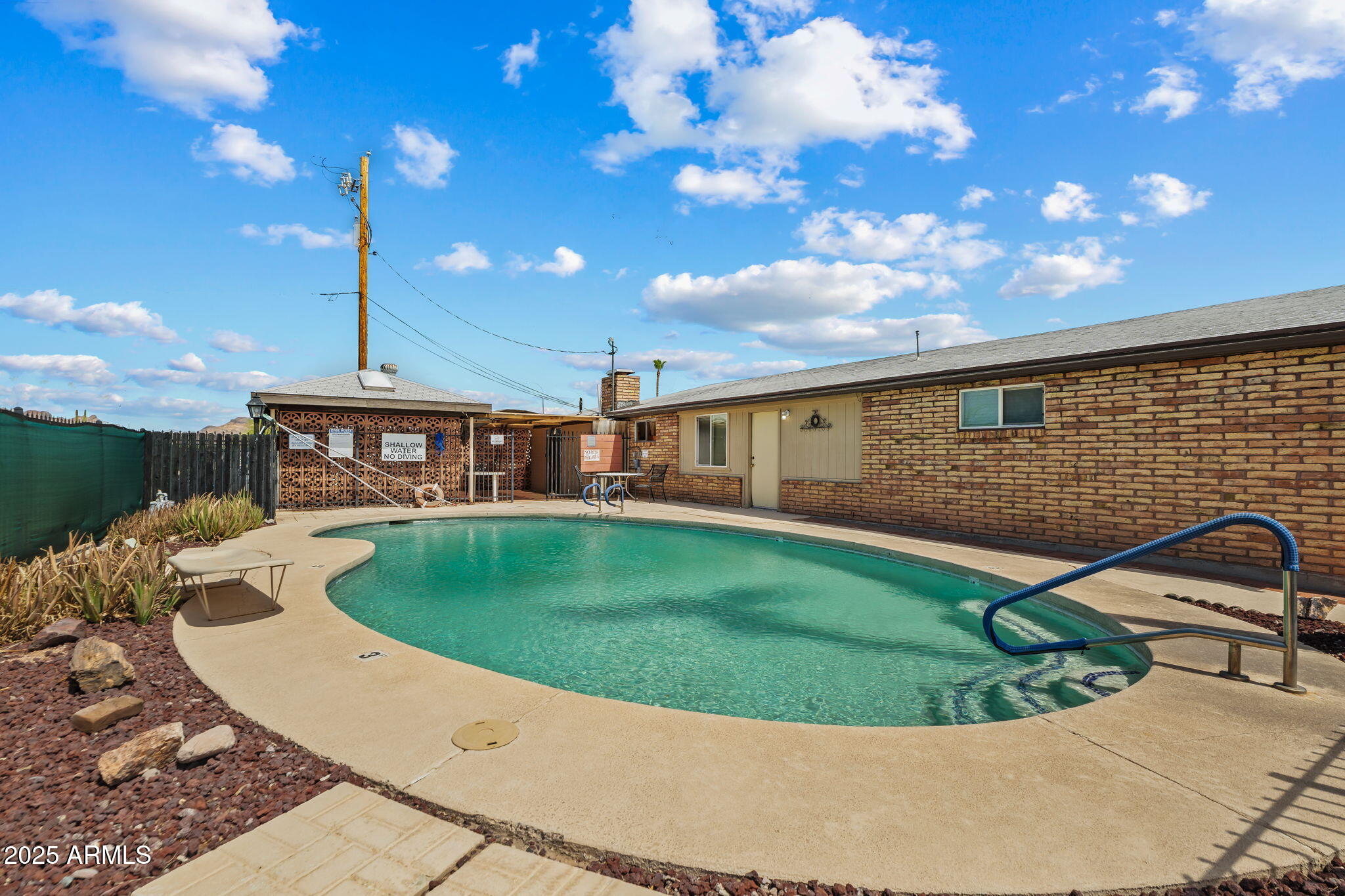 269 North Winchester Road, Unit 63 Apache Junction, AZ 85119 - Photo 14 of 18 a view of a house with a backyard