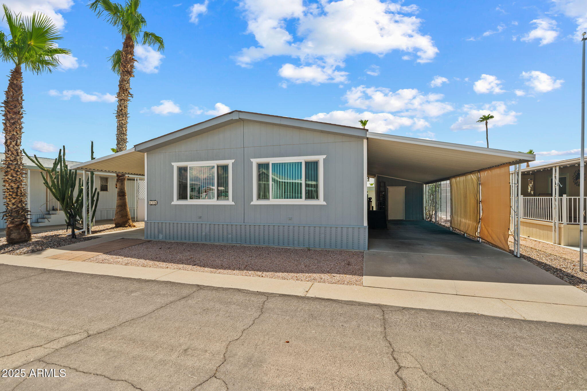 269 North Winchester Road, Unit 63 Apache Junction, AZ 85119 - Photo 16 of 18 a view of a house with a backyard