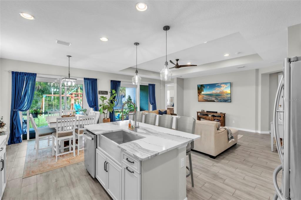 14412 20th Street East Parrish, FL 34219 - Photo 14 of 57 a large kitchen with a table and chairs