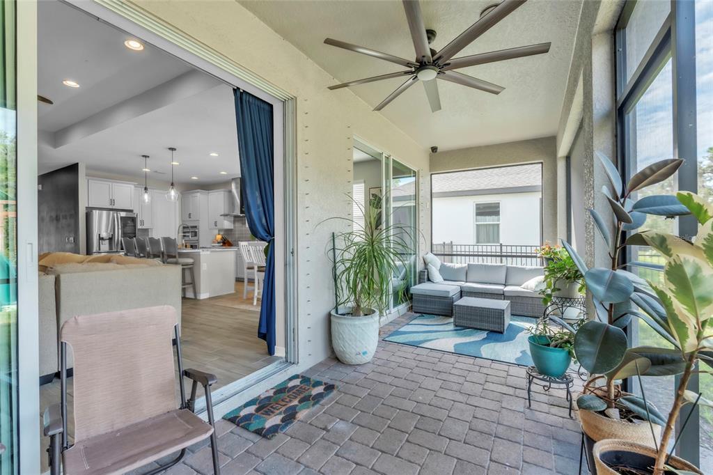 14412 20th Street East Parrish, FL 34219 - Photo 16 of 57 a view of a living room and a dining room with furniture window and wooden floor