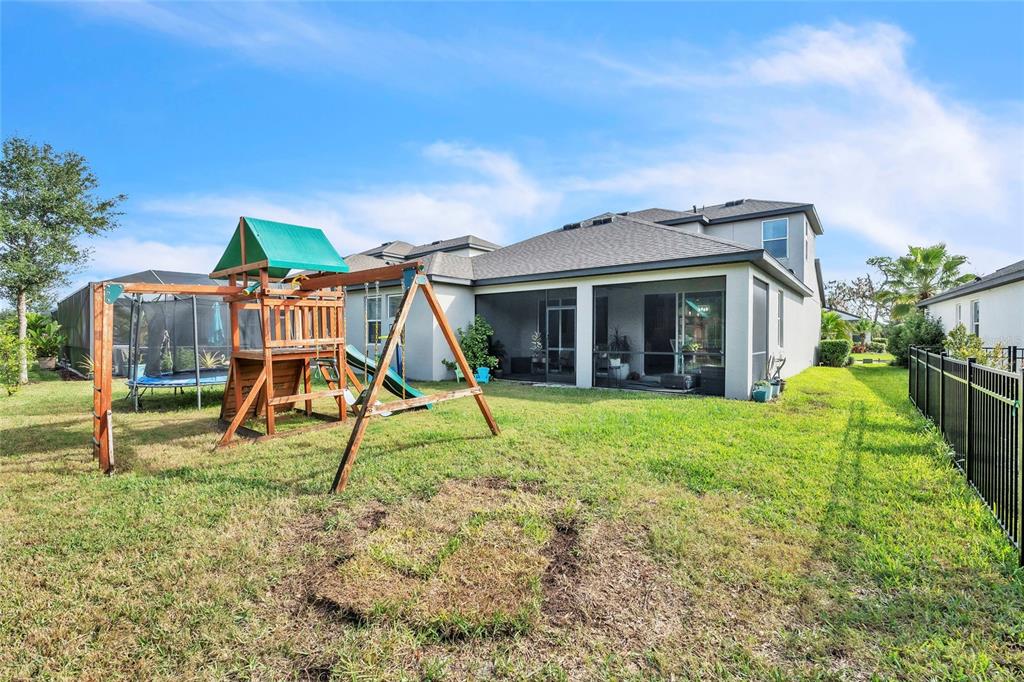 14412 20th Street East Parrish, FL 34219 - Photo 19 of 57 a view of a house with backyard porch and sitting area