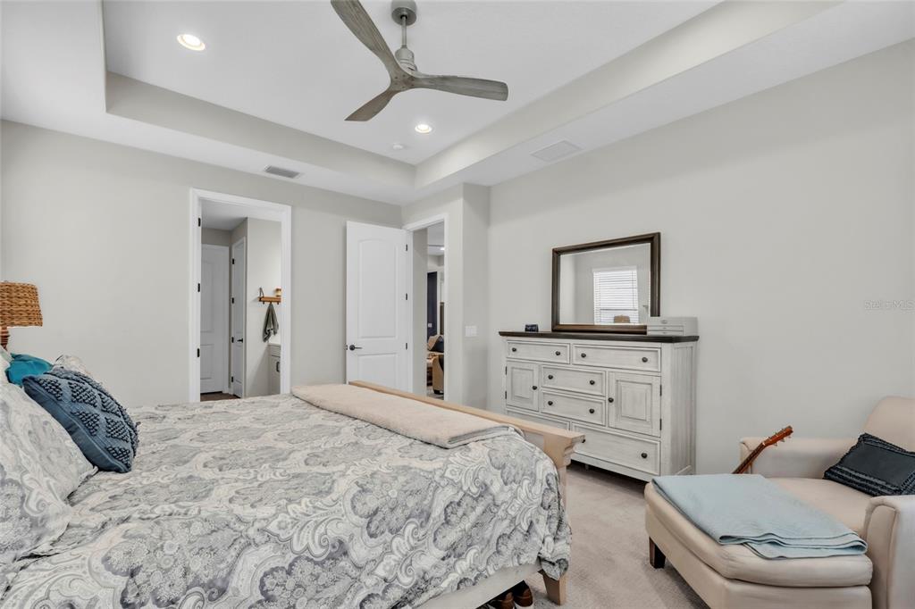 14412 20th Street East Parrish, FL 34219 - Photo 23 of 57 a bedroom with a bed and a couch