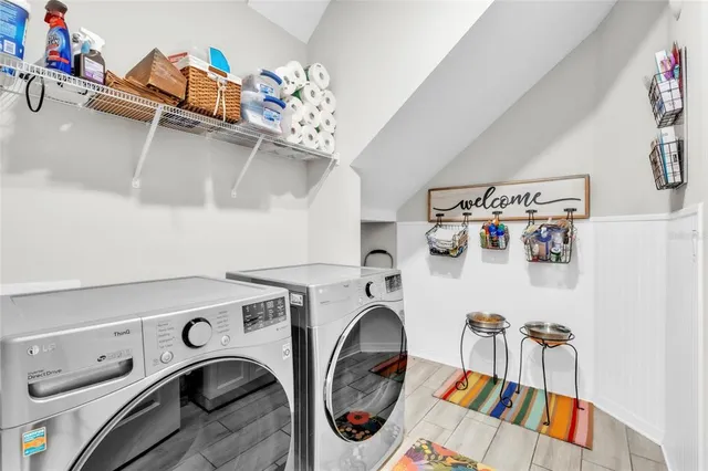 a view of a hallway view with staircase and living room