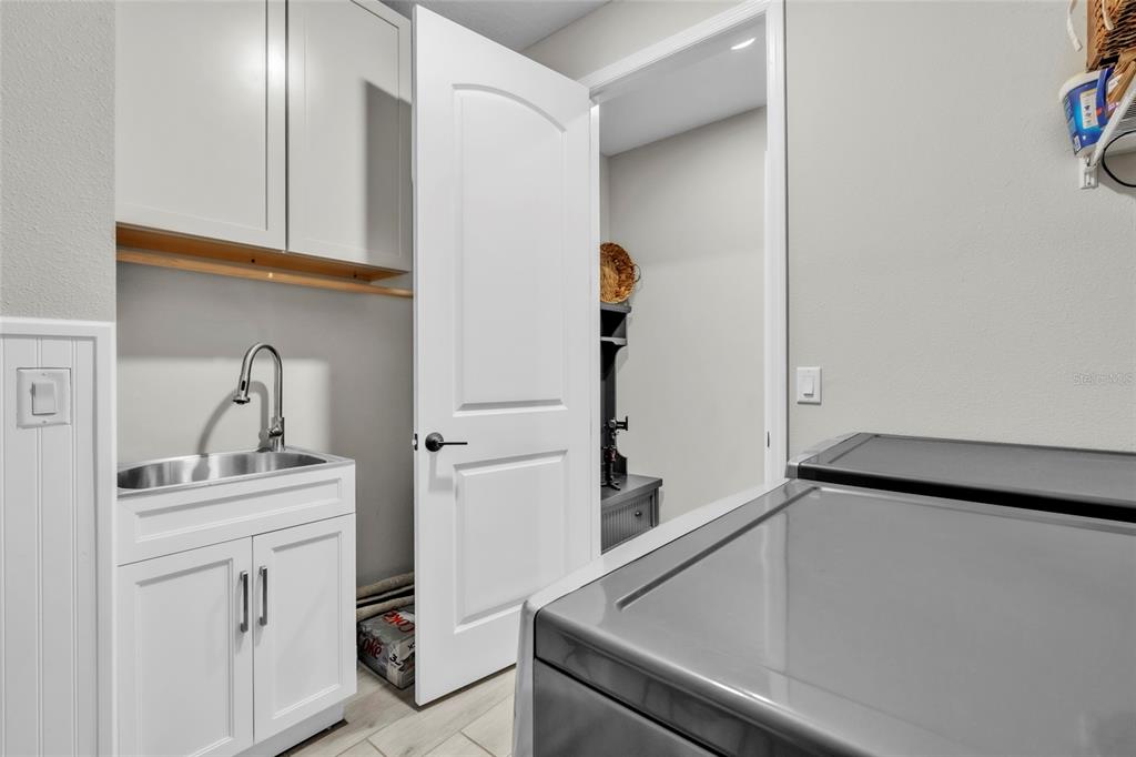 14412 20th Street East Parrish, FL 34219 - Photo 32 of 57 a bathroom with a sink and mirror