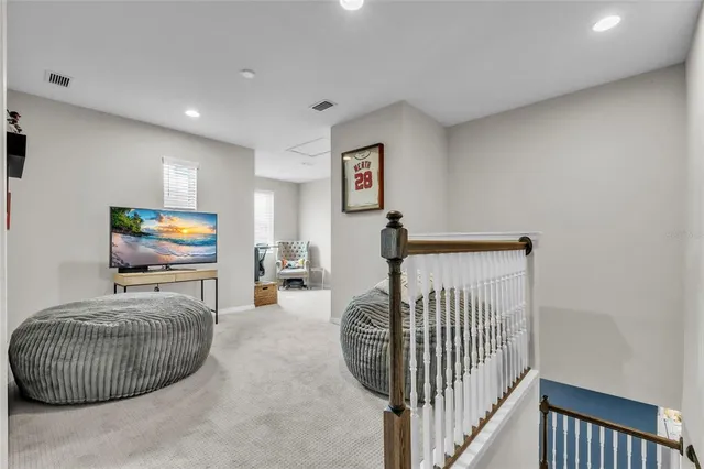 a bedroom with furniture and a baby crib