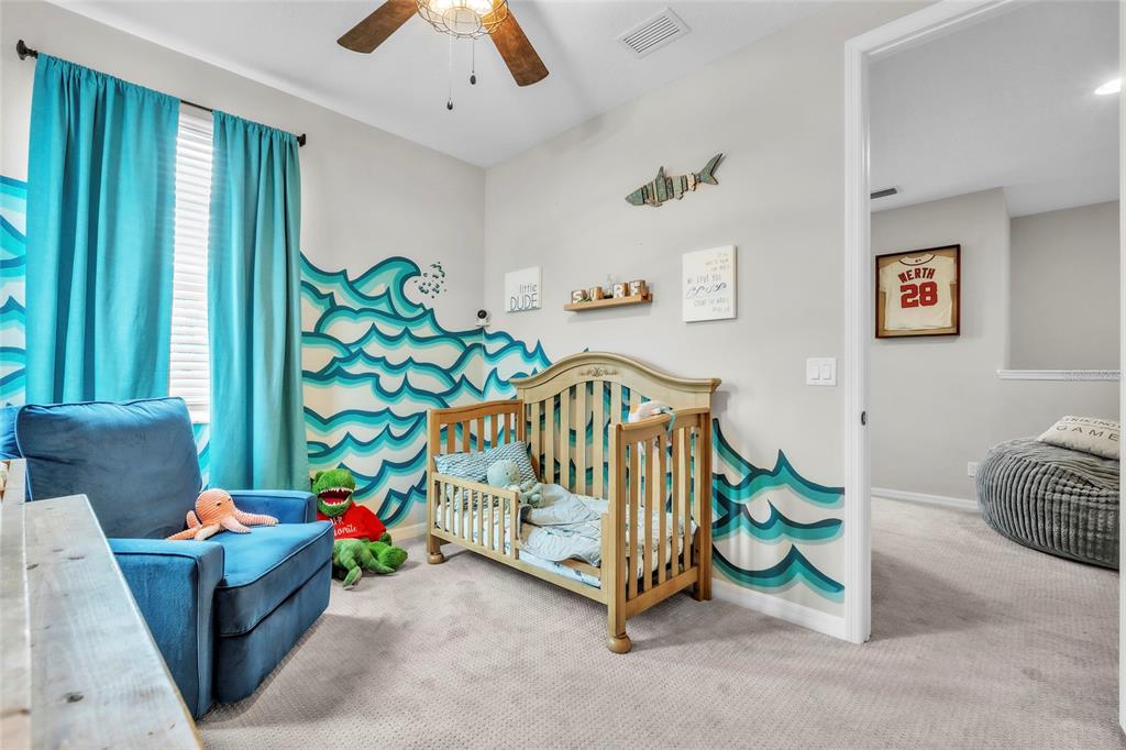 14412 20th Street East Parrish, FL 34219 - Photo 38 of 57 a bedroom with furniture and a couch