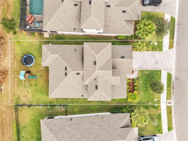 an aerial view of residential houses with outdoor space