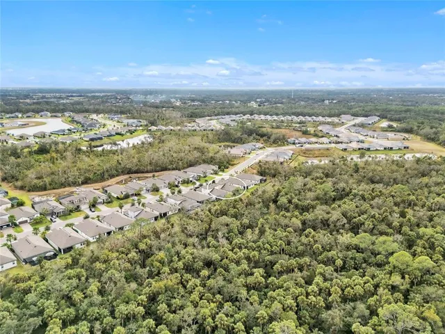 a view of a park with swings and slides