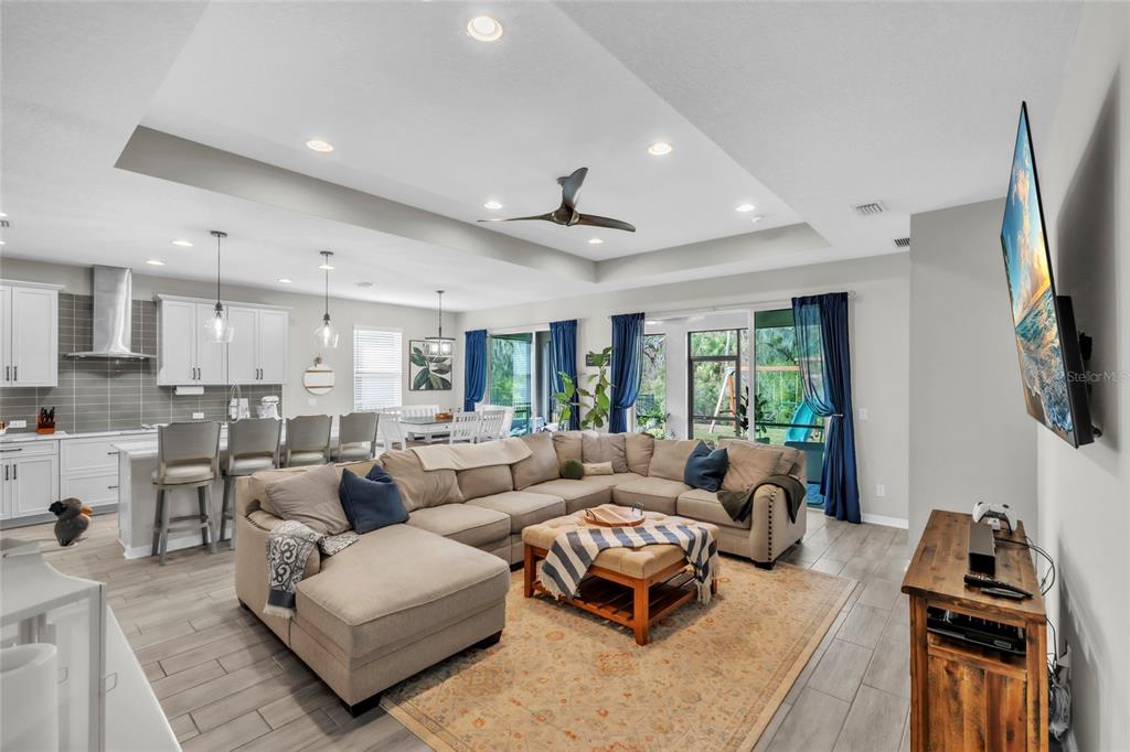 14412 20th Street East Parrish, FL 34219 - Photo 5 of 57 a living room with furniture and a flat screen tv