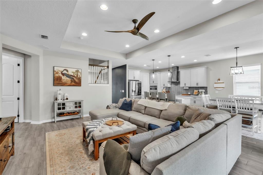 14412 20th Street East Parrish, FL 34219 - Photo 6 of 57 a living room with furniture kitchen view and a chandelier