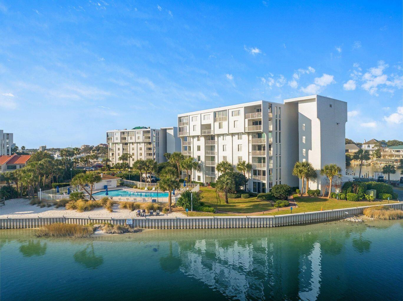 30 Moreno Point Road, Unit 404A Destin, FL 32541 - Photo 29 of 52 a view of swimming pool with outdoor seating and yard in back