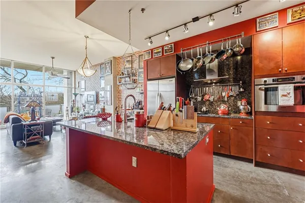 a kitchen that has a lot of cabinets in it