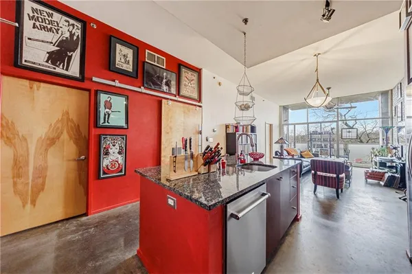 a kitchen that has a lot of cabinets