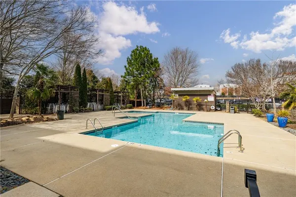 a view of a swimming pool with a patio