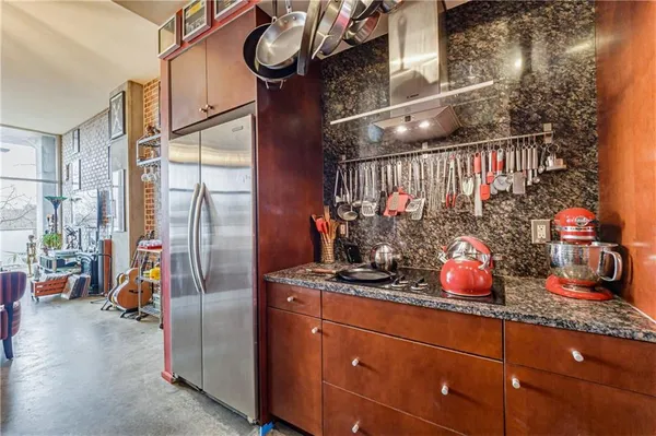 a kitchen with stainless steel appliances a sink and cabinets