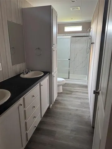 a bathroom with a shower and a toilet