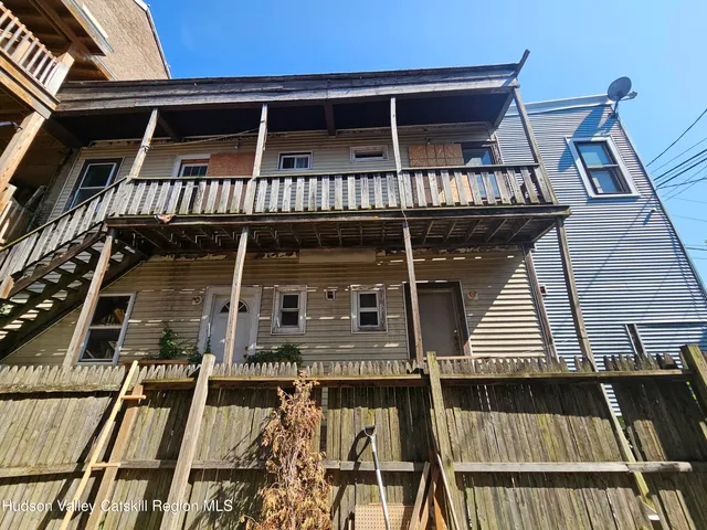 front view of a house with a balcony