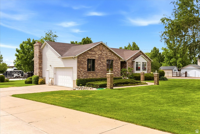 5321 South 3100th Street West Roy, UT 84067 - Photo 58 of 64 Brick and siding exterior with a pitched roof
