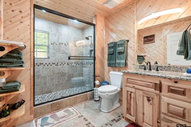 a bathroom with a bathtub and shower