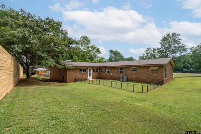 a view of a backyard with potted plants
