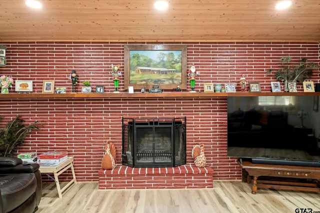 a living room filled with furniture and a flat screen tv