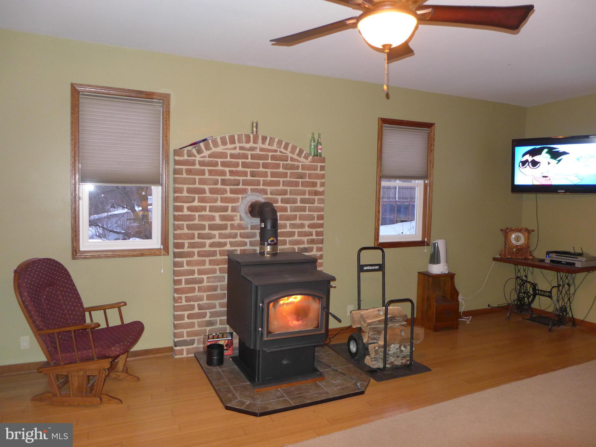 14633 Pennersville Road Cascade, MD 21719 - Photo 8 of 29 a living room with furniture and a fireplace