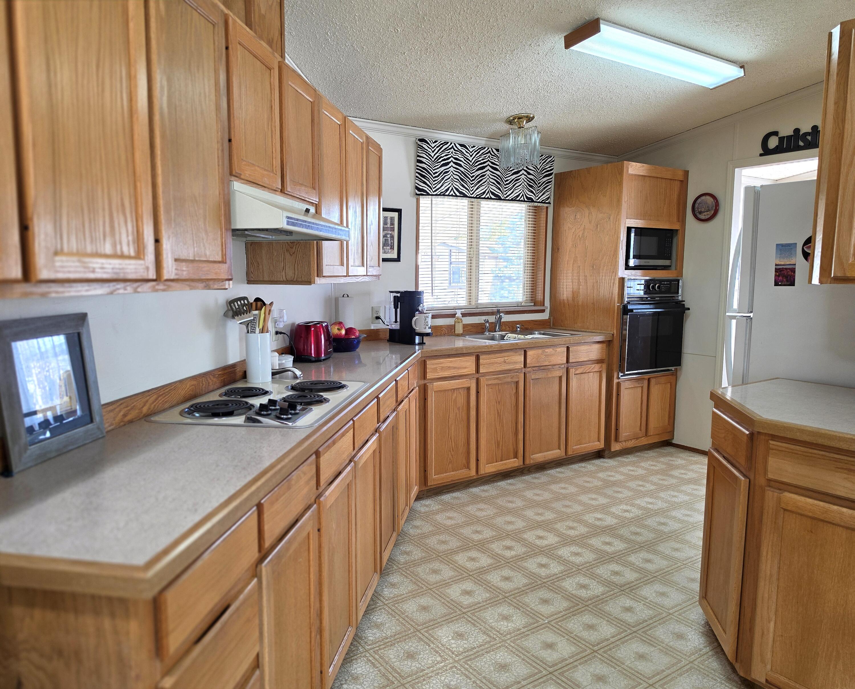 1001 Southeast 15th Street, Unit 35 Bend, OR 97702 - Photo 10 of 36 Kitchen has cooktop and built in oven
