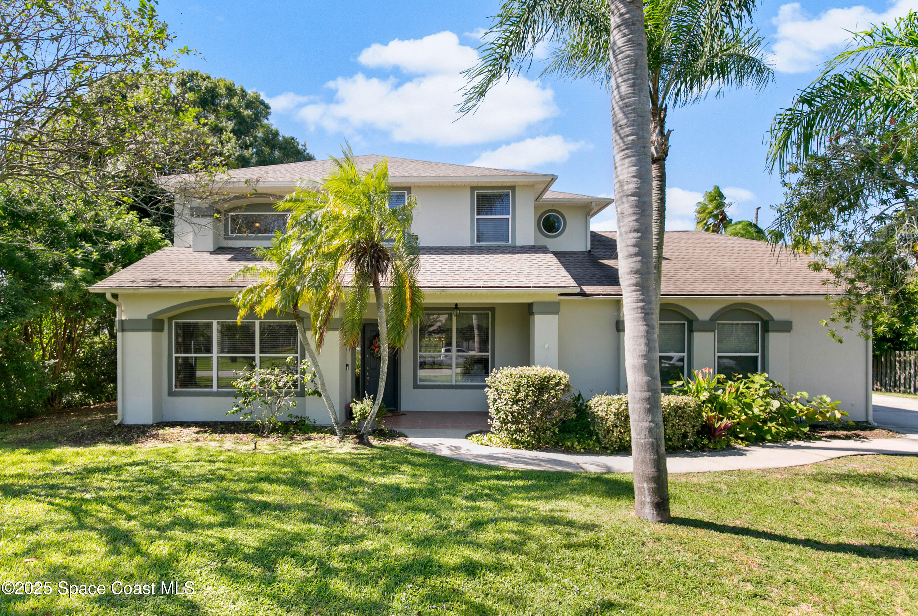 3530 Big Pine Road Melbourne, FL 32934 - Photo 1 of 39 front view of a house with a yard