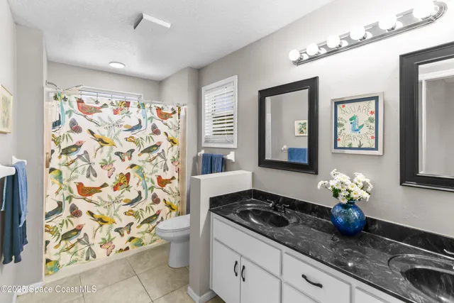 a kitchen with stainless steel appliances a stove a chimney a sink and cabinets