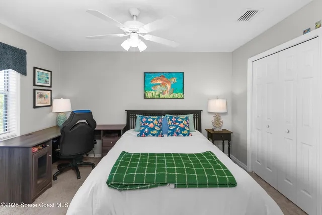 a bedroom with a bed and a chair