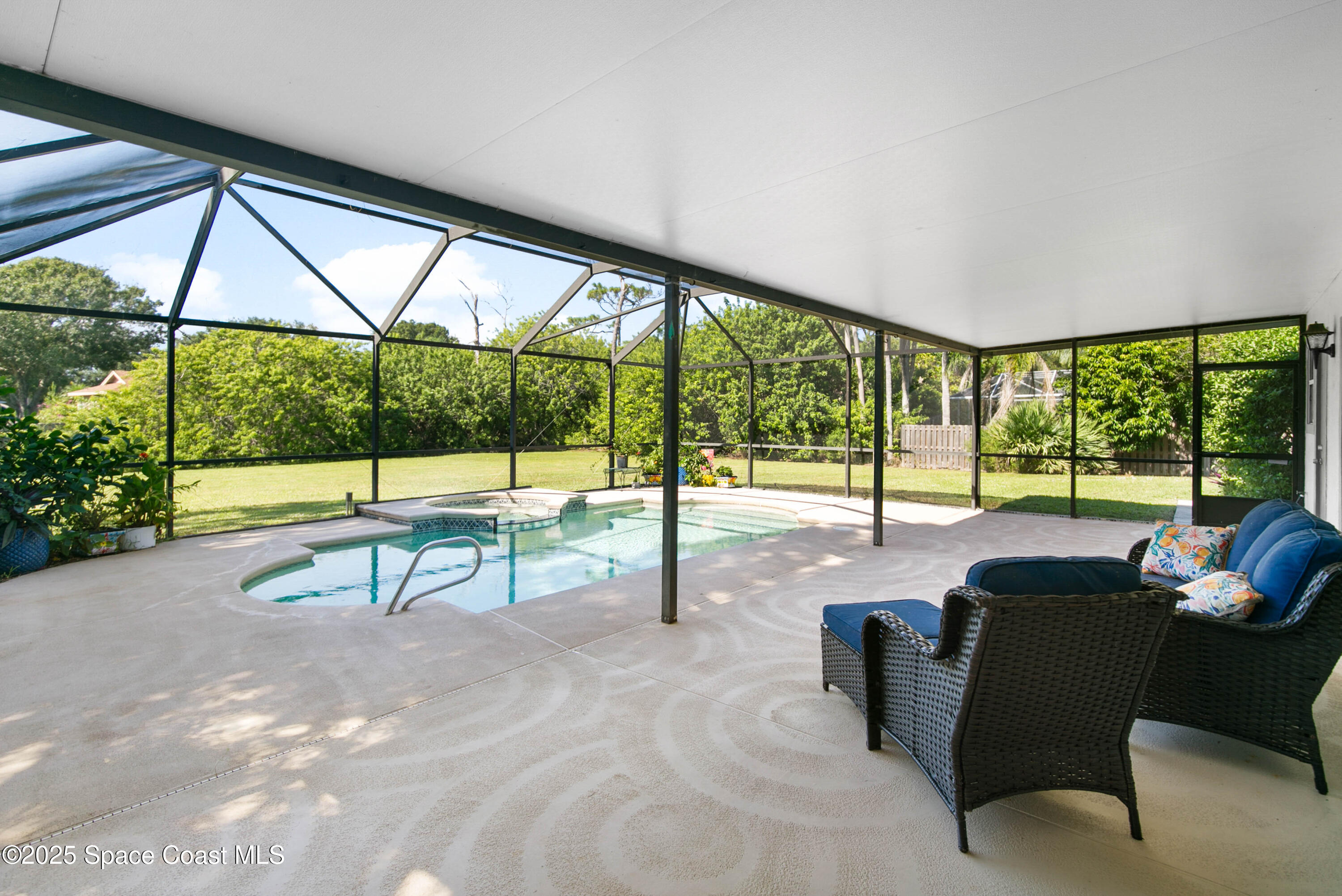 3530 Big Pine Road Melbourne, FL 32934 - Photo 33 of 39 a view of a floor to ceiling window and a table in chairs
