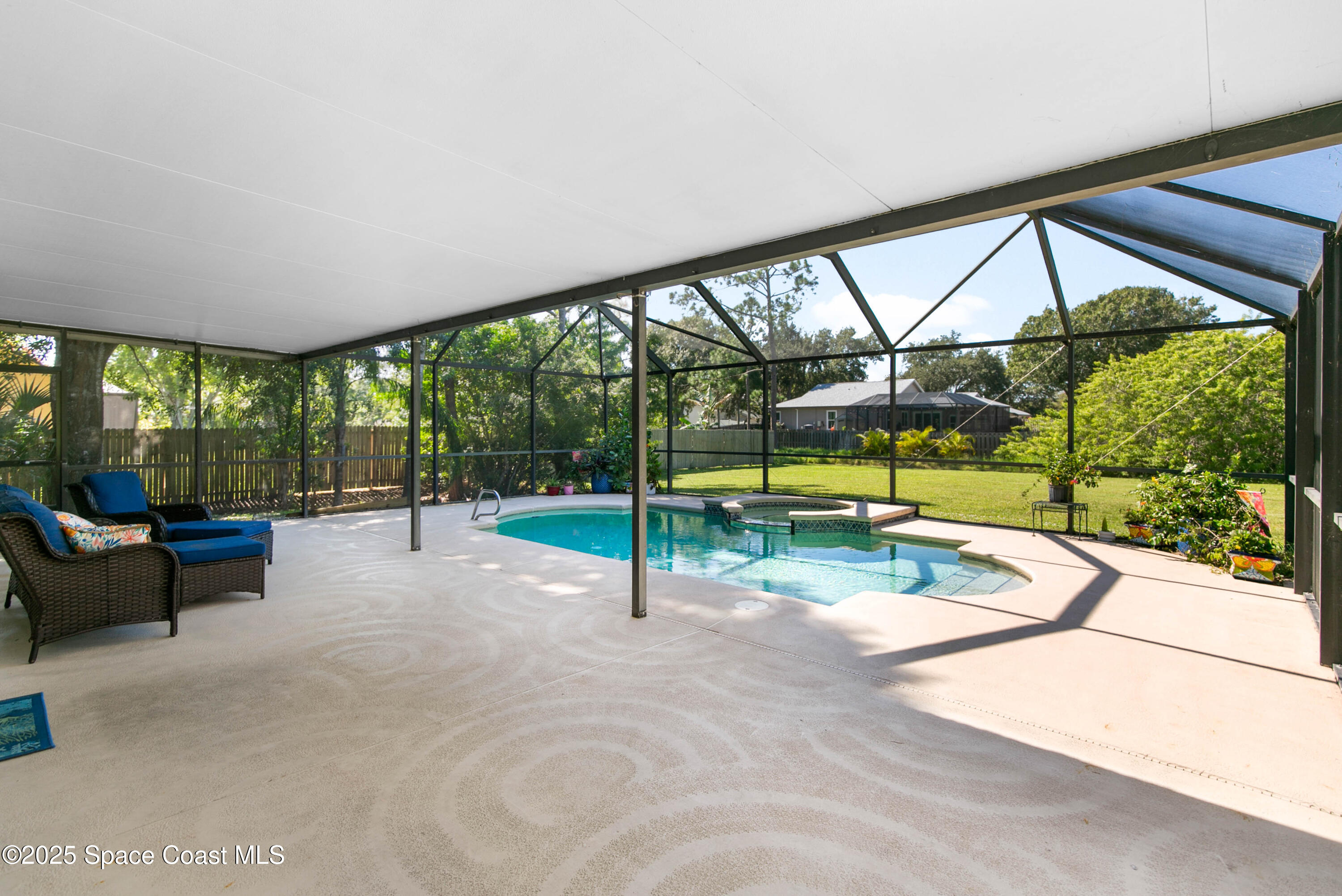 3530 Big Pine Road Melbourne, FL 32934 - Photo 34 of 39 a view of a swimming pool with a patio and a backyard