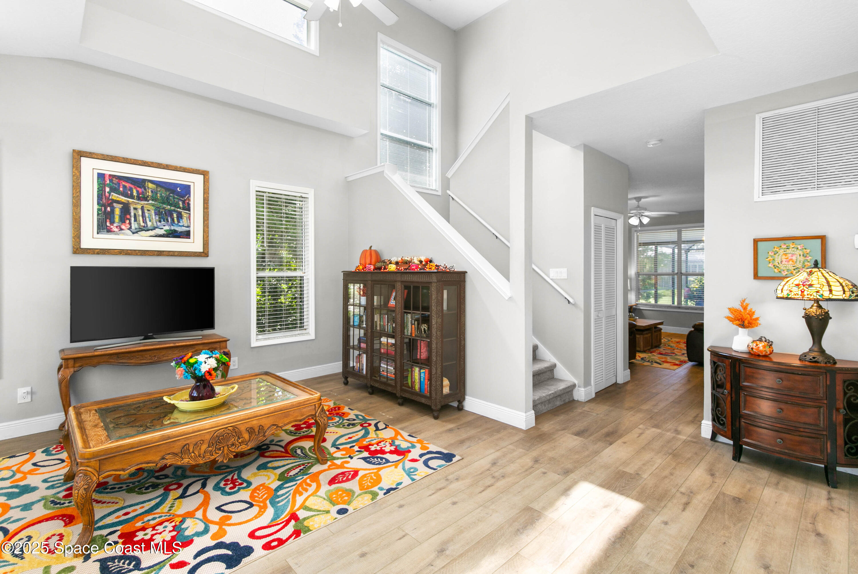 3530 Big Pine Road Melbourne, FL 32934 - Photo 5 of 39 a living room with furniture and a flat screen tv