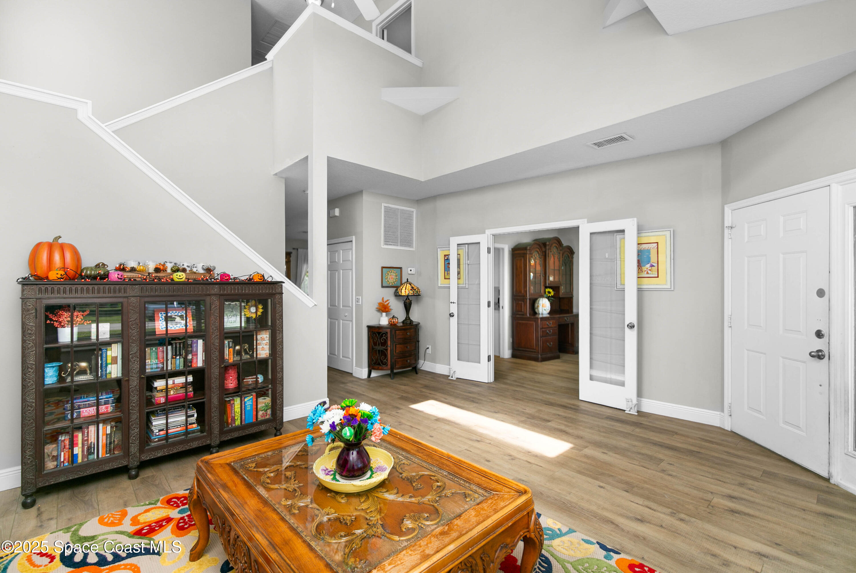 3530 Big Pine Road Melbourne, FL 32934 - Photo 6 of 39 a living room with furniture and wooden floor